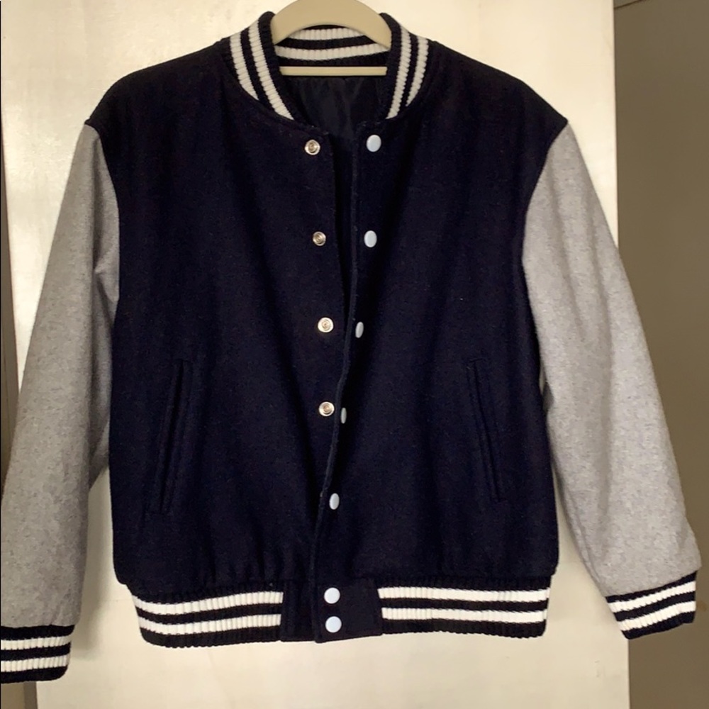 Reversible navy wool to nylon varsity style jkt